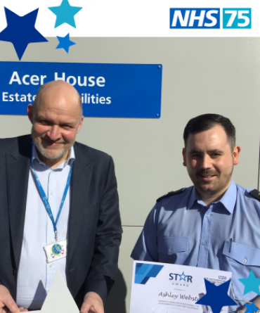 Ashley receiving his Star Award from Simon Morritt.