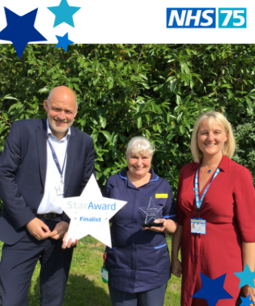 Star Award winner Carol Popplestone receiving her award from Simon Morritt, the Trust's Chief Executive, and Dawn Parkes, the Trust's Chief Nurse.